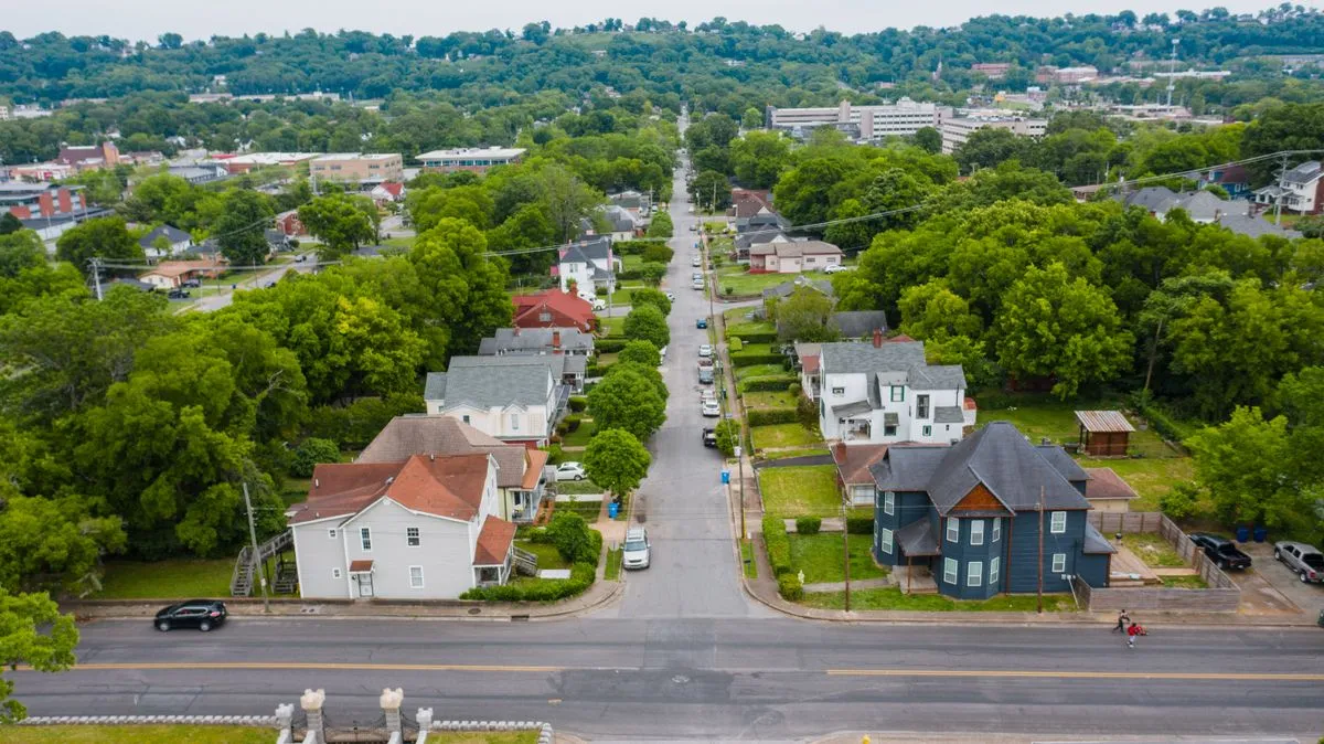 Tree-lined residential neighborhood, shown as supporting stock photography.